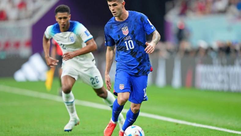 Nov 25, 2022; Al Khor, Qatar; United States of America forward Christian Pulisic (10) dribbles the ball against England during the second half of a group stage match during the 2022 World Cup at Al Bayt Stadium. Mandatory Credit: Danielle Parhizkaran-USA TODAY Sports