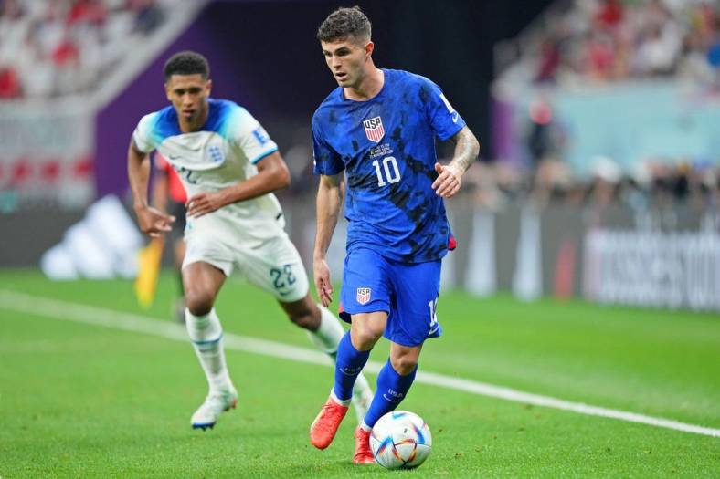 Nov 25, 2022; Al Khor, Qatar; United States of America forward Christian Pulisic (10) dribbles the ball against England during the second half of a group stage match during the 2022 World Cup at Al Bayt Stadium. Mandatory Credit: Danielle Parhizkaran-USA TODAY Sports