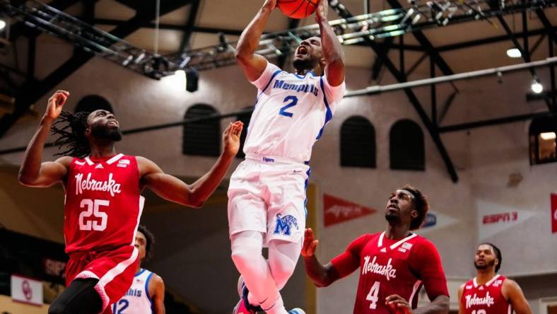 Nov 25, 2022; Orlando, FL, USA; Memphis Tigers guard Alex Lomax (2) shoots against Nebraska Cornhuskers guard Emmanuel Bandoumel (25) during the second half  at ESPN Wide World of Sports. Mandatory Credit: Rich Storry-USA TODAY Sports