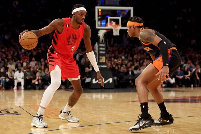 Nov 25, 2022; New York, New York, USA; Portland Trail Blazers forward Jerami Grant (9) controls the ball against New York Knicks guard Miles McBride (2) during the first quarter at Madison Square Garden. Mandatory Credit: Brad Penner-USA TODAY Sports