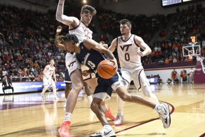 Nov 25, 2022; Blacksburg, Virginia, USA; Charleston Southern Buccaneers guard Tahlik Chavez (13) dribbles the ball defended by Virginia Tech Hokies forward Grant Basile (21) in the first half at Cassell Coliseum. Mandatory Credit: Lee Luther Jr.-USA TODAY Sports