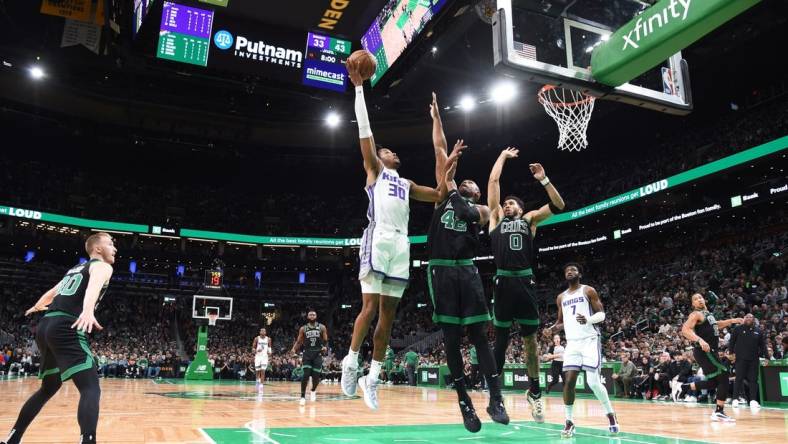 Nov 25, 2022; Boston, Massachusetts, USA;  Sacramento Kings forward KZ Okpala (30) shoots the ball over Boston Celtics center Al Horford (42) during the first half at TD Garden. Mandatory Credit: Bob DeChiara-USA TODAY Sports