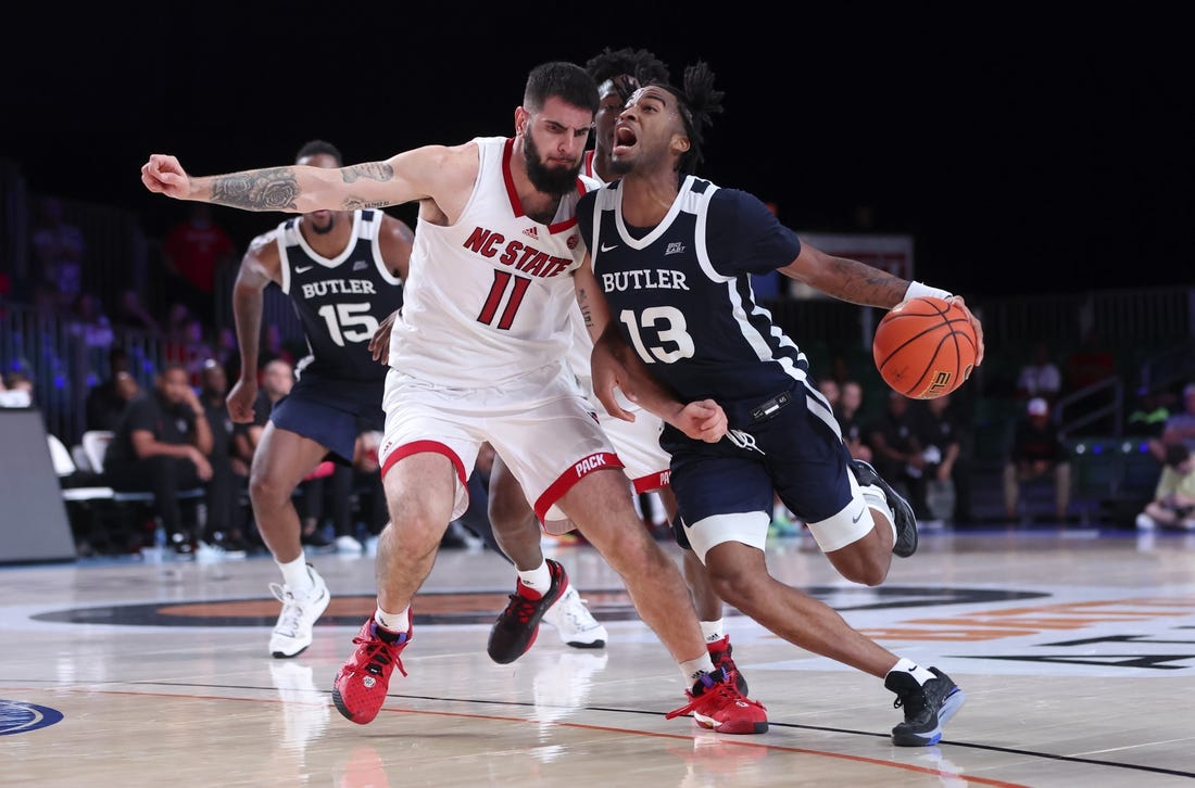 Nov 25, 2022; Paradise Island, BAHAMAS; Butler Bulldogs guard Jayden Taylor (13) drives to the basket as North Carolina State Wolfpack forward Dusan Mahorcic (11) defends during the second half at Imperial Arena. Mandatory Credit: Kevin Jairaj-USA TODAY Sports