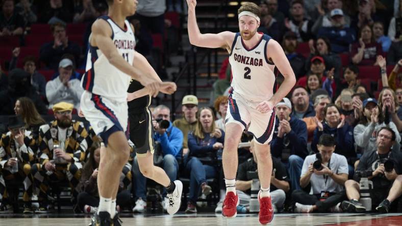 Nov 25, 2022; Portland, Oregon, USA;  Gonzaga Bulldogs forward Drew Timme (2) celebrates after scoring a basket during the second half against the Purdue Boilermakers at Moda Center. Purdue won the game 84-66. Mandatory Credit: Troy Wayrynen-USA TODAY Sports