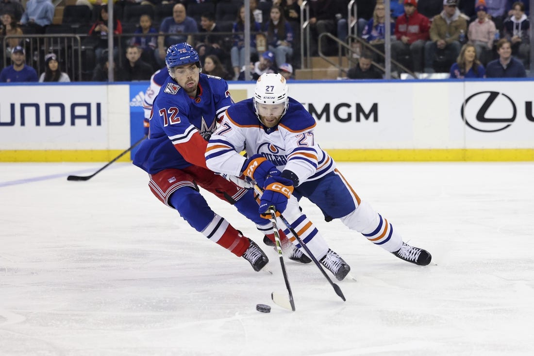 Nov 26, 2022; New York, New York, USA; Edmonton Oilers defenseman Brett Kulak (27) skates against New York Rangers center Filip Chytil (72) during the first period at Madison Square Garden. Mandatory Credit: Jessica Alcheh-USA TODAY Sports