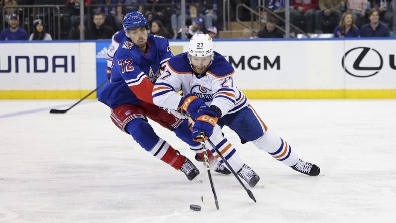 Nov 26, 2022; New York, New York, USA; Edmonton Oilers defenseman Brett Kulak (27) skates against New York Rangers center Filip Chytil (72) during the first period at Madison Square Garden. Mandatory Credit: Jessica Alcheh-USA TODAY Sports