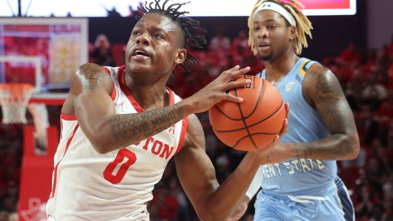 Nov 26, 2022; Houston, Texas, USA; Houston Cougars guard Marcus Sasser (0) drives to the net as Kent State Golden Flashes forward VonCameron Davis (1) chases in the first half at the Fertitta Center. Mandatory Credit: Thomas Shea-USA TODAY Sports