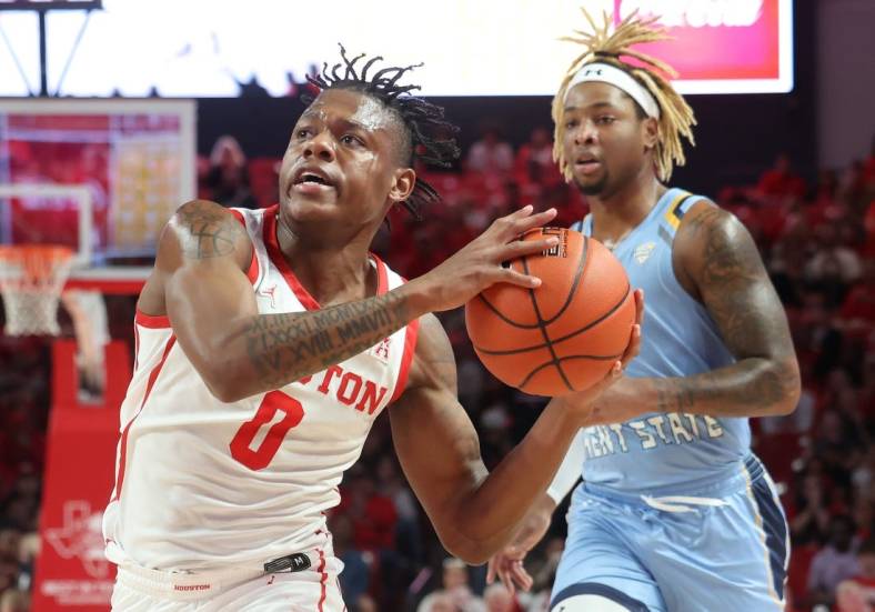 Nov 26, 2022; Houston, Texas, USA; Houston Cougars guard Marcus Sasser (0) drives to the net as Kent State Golden Flashes forward VonCameron Davis (1) chases in the first half at the Fertitta Center. Mandatory Credit: Thomas Shea-USA TODAY Sports