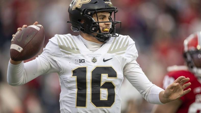 Nov 26, 2022; Bloomington, Indiana, USA;  Purdue Boilermakers quarterback Aidan O'Connell (16) looks to throw a quick pass during the second quarter against the Indiana Hoosiers at Memorial Stadium. Mandatory Credit: Marc Lebryk-USA TODAY Sports