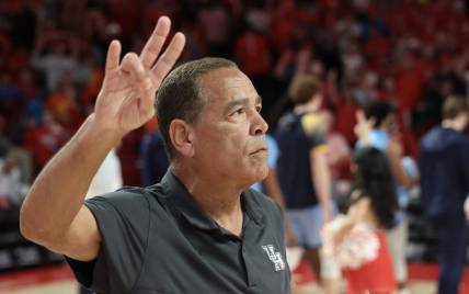 Nov 26, 2022; Houston, Texas, USA;  Houston Cougars head coach Kelvin Sampson stands for the school song after defeating the Kent State Golden Flashes at the Fertitta Center. Mandatory Credit: Thomas Shea-USA TODAY Sports