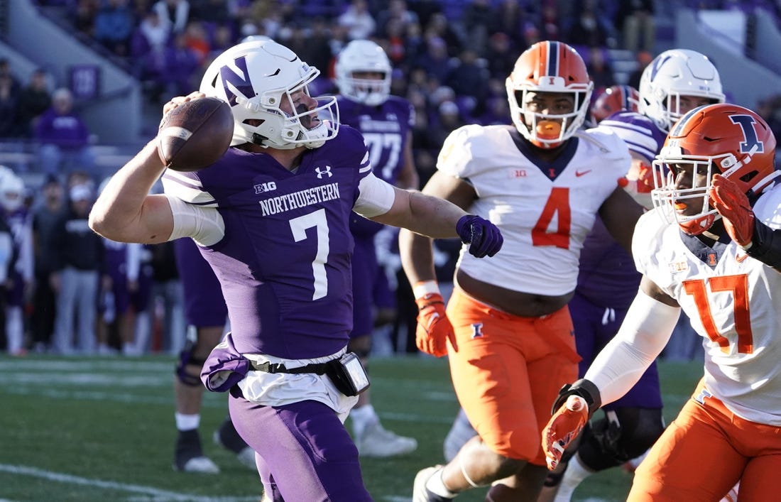 Nov 26, 2022; Evanston, Illinois, USA; Northwestern Wildcats quarterback Cole Freeman (7) looks to pass against the Illinois Fighting Illini during the first half at Ryan Field. Mandatory Credit: David Banks-USA TODAY Sports