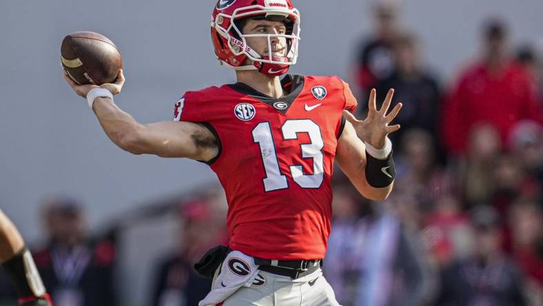 Nov 26, 2022; Athens, Georgia, USA; Georgia Bulldogs quarterback Stetson Bennett (13) passes the ball against the Georgia Tech Yellow Jackets during the first half at Sanford Stadium. Mandatory Credit: Dale Zanine-USA TODAY Sports