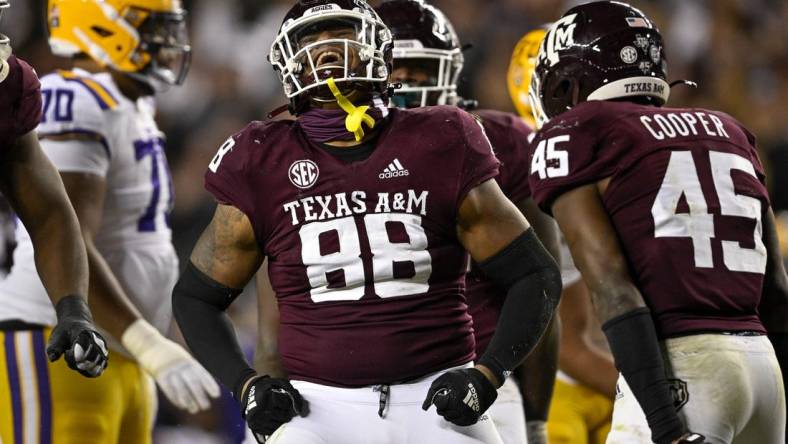 Nov 26, 2022; College Station, Texas, USA; Texas A&M Aggies defensive lineman Walter Nolen (88) and linebacker Edgerrin Cooper (45) celebrate a defensive stop against the LSU Tigers during the second half at Kyle Field. Mandatory Credit: Jerome Miron-USA TODAY Sports