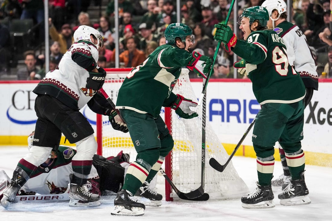 Nov 27, 2022; Saint Paul, Minnesota, USA; Minnesota Wild center Sam Steel (13) celebrates his goal with left wing Kirill Kaprizov (97) during the second period against the Arizona Coyotes at Xcel Energy Center. Mandatory Credit: Brace Hemmelgarn-USA TODAY Sports