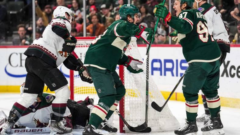 Nov 27, 2022; Saint Paul, Minnesota, USA; Minnesota Wild center Sam Steel (13) celebrates his goal with left wing Kirill Kaprizov (97) during the second period against the Arizona Coyotes at Xcel Energy Center. Mandatory Credit: Brace Hemmelgarn-USA TODAY Sports