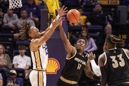 Nov 27, 2022; Baton Rouge, Louisiana, USA;  Wofford Terriers forward Amarri Tice (11) steals the ball from LSU Tigers forward Jalen Reed (13) during the first half at Pete Maravich Assembly Center. Mandatory Credit: Stephen Lew-USA TODAY Sports
