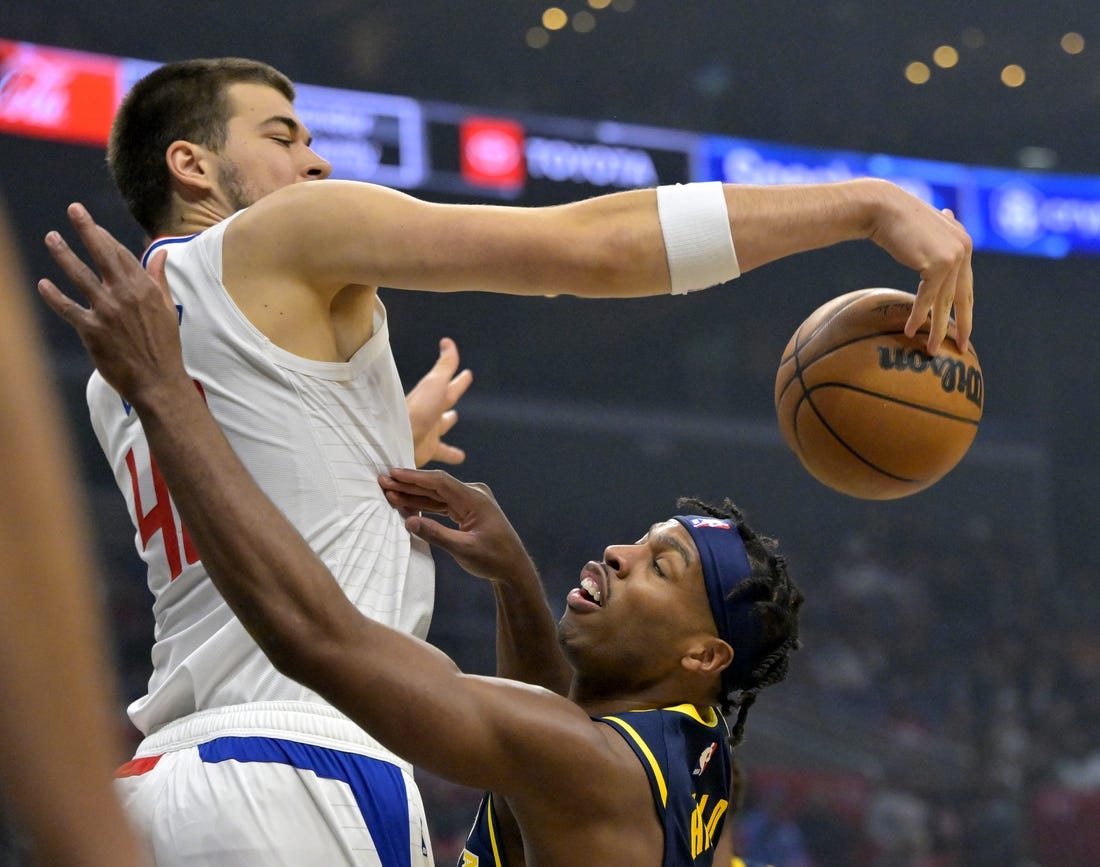 Nov 27, 2022; Los Angeles, California, USA;  Los Angeles Clippers center Ivica Zubac (40) blocks a shot by Indiana Pacers guard Buddy Hield (24) in the first half at Crypto.com Arena. Mandatory Credit: Jayne Kamin-Oncea-USA TODAY Sports