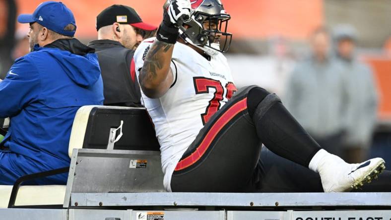 Nov 27, 2022; Cleveland, Ohio, USA; Tampa Bay Buccaneers offensive tackle Tristan Wirfs (78) rides off the field after being injured during the second half against the Cleveland Browns at FirstEnergy Stadium. Mandatory Credit: Ken Blaze-USA TODAY Sports