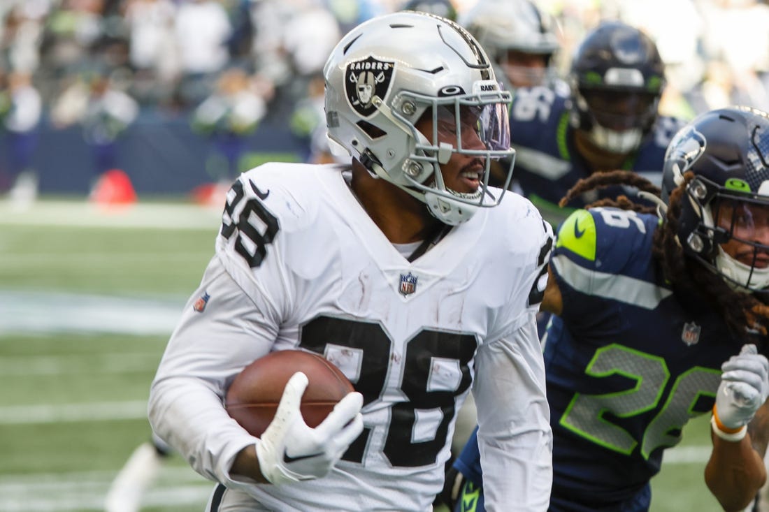 Las Vegas Raiders running back Josh Jacobs (28) leaves the field