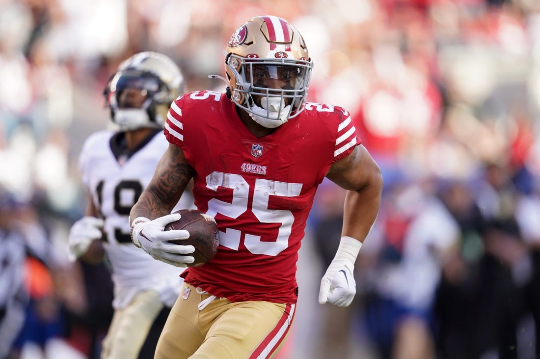 Nov 27, 2022; Santa Clara, California, USA; San Francisco 49ers running back Elijah Mitchell (25) runs the ball against the New Orleans Saints in the second quarter at Levi's Stadium. Mandatory Credit: Cary Edmondson-USA TODAY Sports