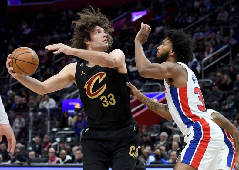 Nov 27, 2022; Detroit, Michigan, USA;  Cleveland Cavaliers center Robin Lopez (33) shoots against Detroit Pistons center Marvin Bagley III (33) in the first quarter at Little Caesars Arena. Mandatory Credit: Lon Horwedel-USA TODAY Sports