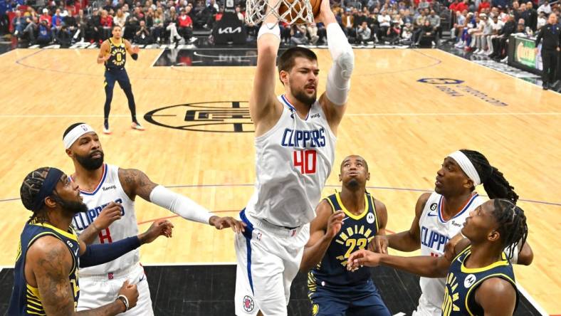 Nov 27, 2022; Los Angeles, California, USA; Los Angeles Clippers center Ivica Zubac (40) grabs a rebound in the first half against the Indiana Pacers at Crypto.com Arena. Mandatory Credit: Jayne Kamin-Oncea-USA TODAY Sports