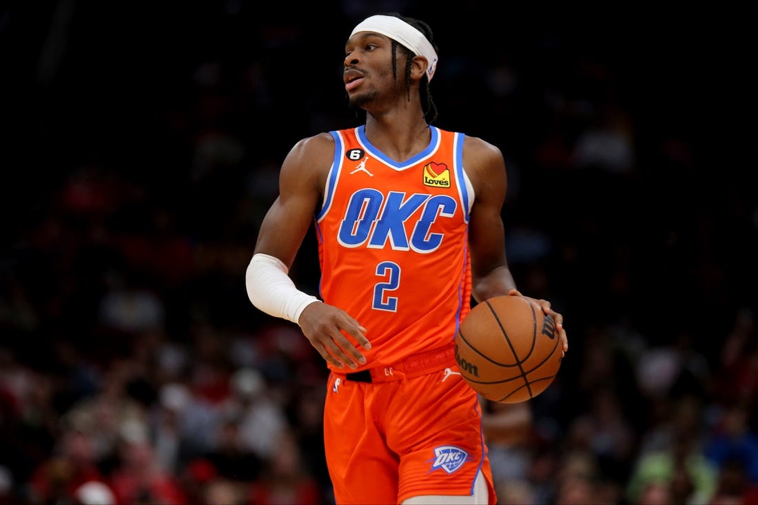 Nov 26, 2022; Houston, Texas, USA; Oklahoma City Thunder guard Shai Gilgeous-Alexander (2) handles the ball against the Houston Rockets during the game at Toyota Center. Mandatory Credit: Erik Williams-USA TODAY Sports