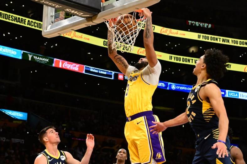 Nov 28, 2022; Los Angeles, California, USA; Los Angeles Lakers forward Anthony Davis (3) dunks in the second half against the Indiana Pacers at Crypto.com Arena. Mandatory Credit: Richard Mackson-USA TODAY Sports