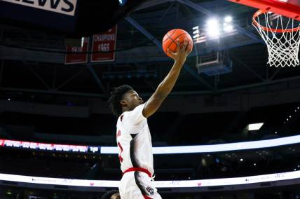 Nov 29, 2022; Raleigh, North Carolina, USA; North Carolina State Wolfpack guard Jarkel Joiner (1) dunks during the first half against William & Mary Tribe at PNC Arena. Mandatory Credit: Jaylynn Nash-USA TODAY Sports