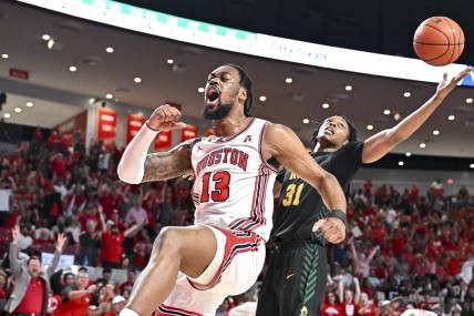 Nov 29, 2022; Houston, Texas, USA; Houston Cougars forward J'Wan Roberts (13) reacts after a dunk against the Norfolk State Spartans during the first half at Fertitta Center. Mandatory Credit: Maria Lysaker-USA TODAY Sports