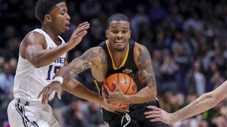 Nov 30, 2022; Cincinnati, Ohio, USA; Southeastern Louisiana Lions guard Christian Agnew (24) moves to the basket against Xavier Musketeers guard KyKy Tandy (15) in the first half at Cintas Center. Mandatory Credit: Katie Stratman-USA TODAY Sports