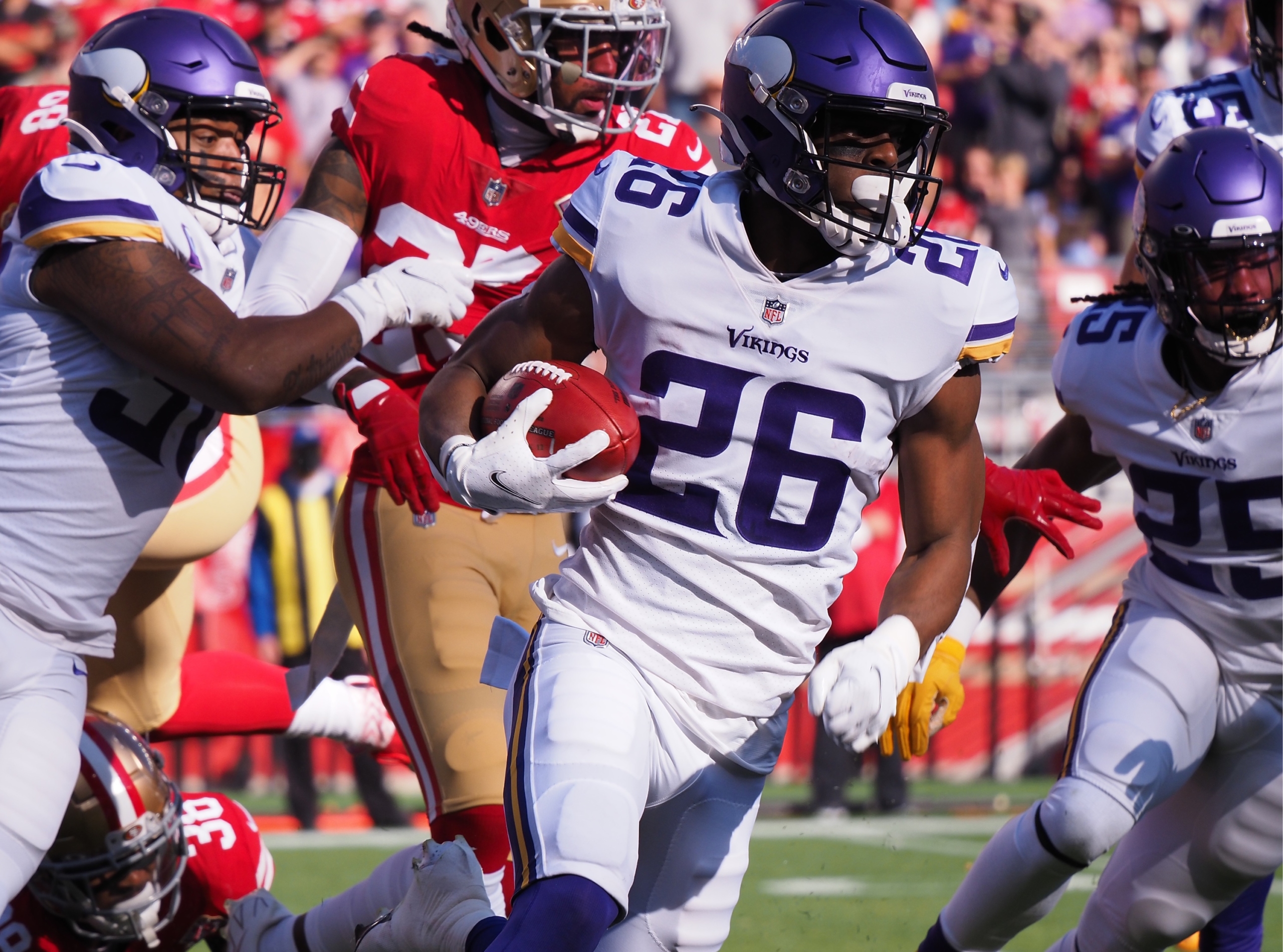 MINNEAPOLIS, MN - JANUARY 15: Minnesota Vikings running back Kene Nwangwu  (26) hypes up the crowd during the NFL game between the New York Giants and Minnesota  Vikings on January 15th, 2023