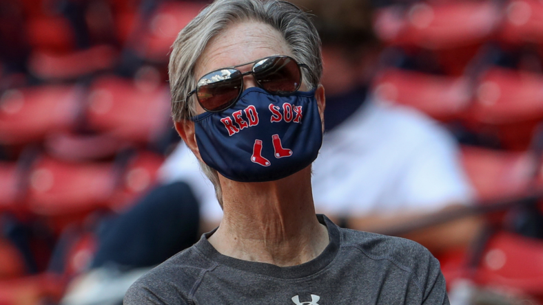 boston red sox owner john henry interested in buying the washington commanders