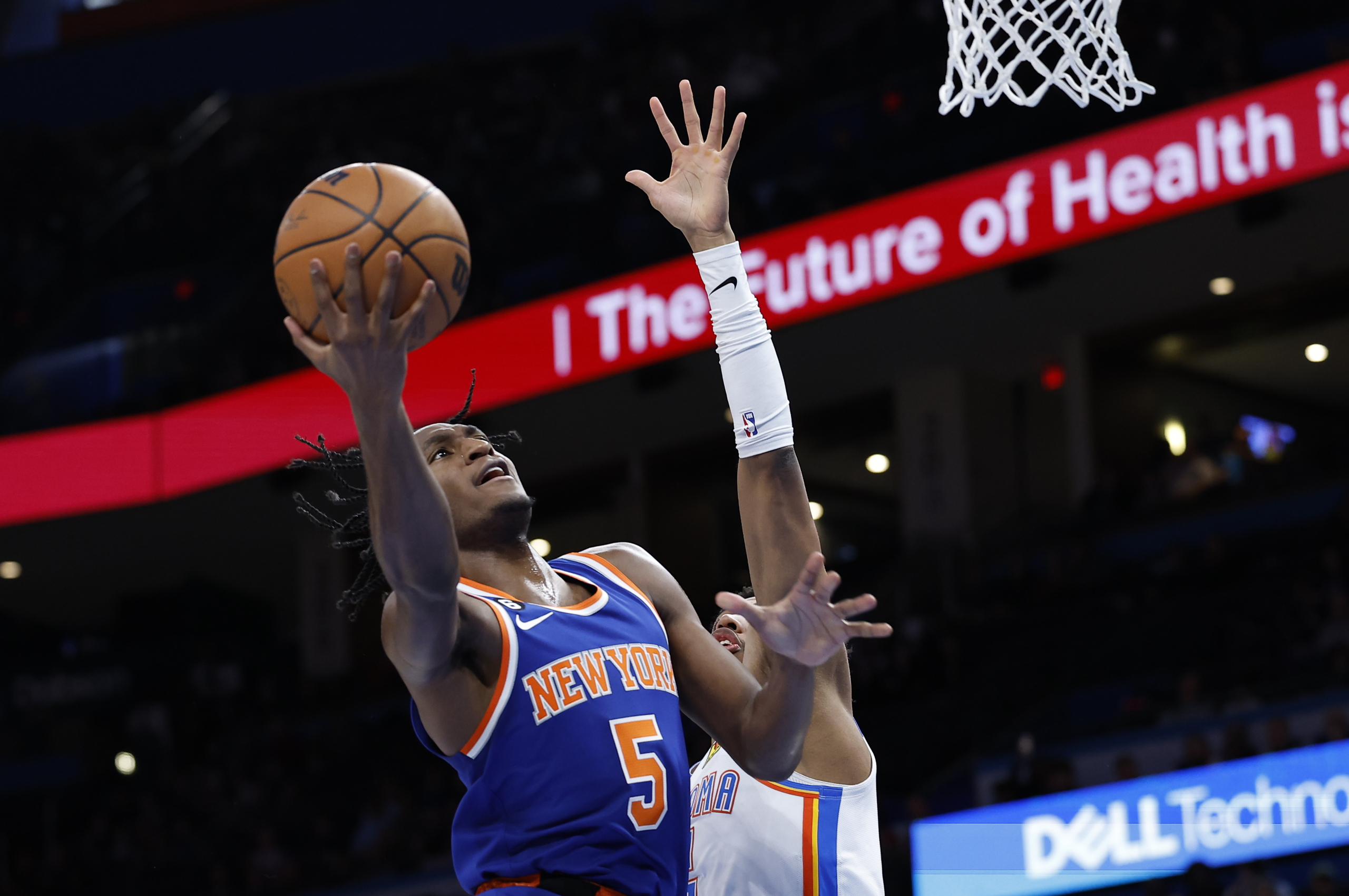 New York Knicks' Immanuel Quickley (5) gets off the court after