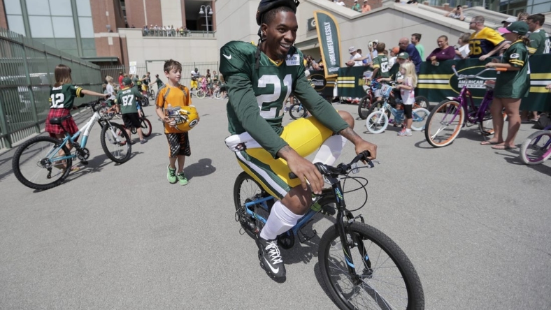 2016: Green Bay Packers free safety Ha Ha Clinton-Dix (21) smiles as he rides a bike to Green Bay Packers training camp  August 15, 2016.

2016 2