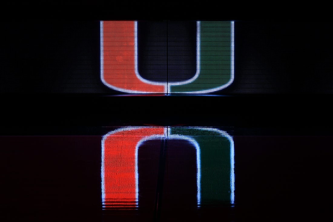 Dec 8, 2020; Coral Gables, Florida, USA; A general view of a reflection of the Miami Hurricanes school logo on the scorers table prior to the game between the Miami Hurricanes and the Purdue Boilermakers at Watsco Center. Mandatory Credit: Jasen Vinlove-USA TODAY Sports