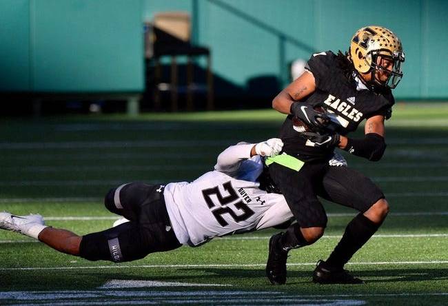 Abilene High receiver Frederick Johnson (7) tries to break a tackle of Denton Guyer's Peyton Bowen (22) during the first half of Saturday's Region I-6A Division II semifinal at Globe Life Park in Arlington.

Ahs Fb Dguyer Halftime