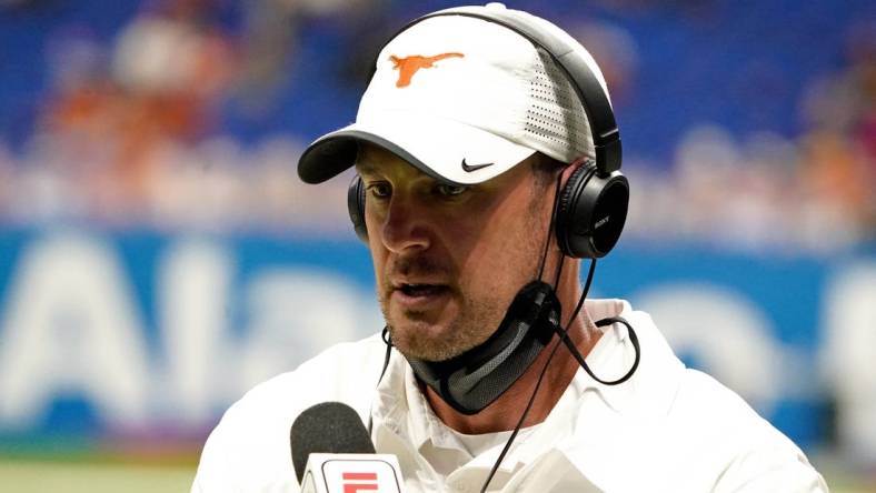 Dec 29, 2020; San Antonio, TX, USA; Texas Longhorns head coach Tom Herman is being interviewed during the first half against the Colorado Buffaloes at Alamodome. Mandatory Credit: Kirby Lee-USA TODAY Sports