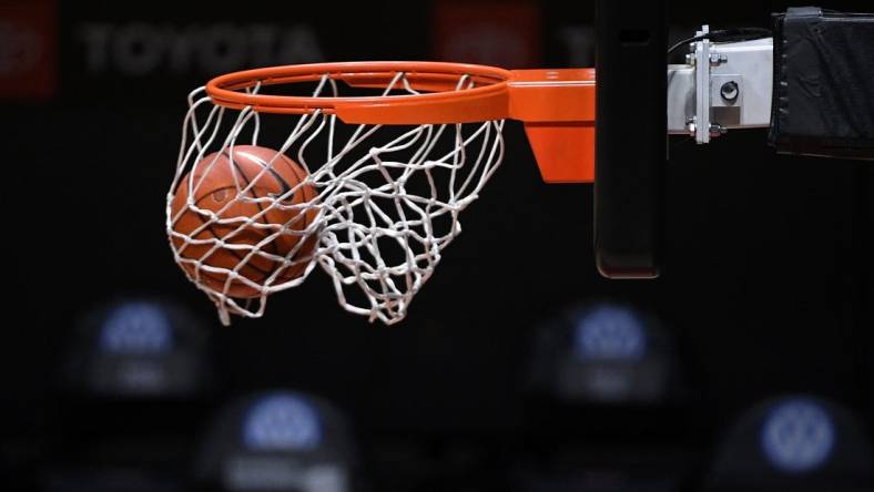 Jan 7, 2021; San Diego, California, USA; A detailed view of a Nike basketball going through a hoop before the game between the San Diego State Aztecs and the Nevada Wolf Pack at Viejas Arena. Mandatory Credit: Orlando Ramirez-USA TODAY Sports