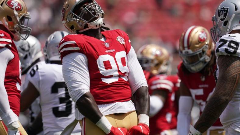 Aug 29, 2021; Santa Clara, California, USA; San Francisco 49ers defensive tackle Javon Kinlaw (99) reacts after making a tackle against the Las Vegas Raiders in the first quarter at Levi's Stadium. Mandatory Credit: Cary Edmondson-USA TODAY Sports