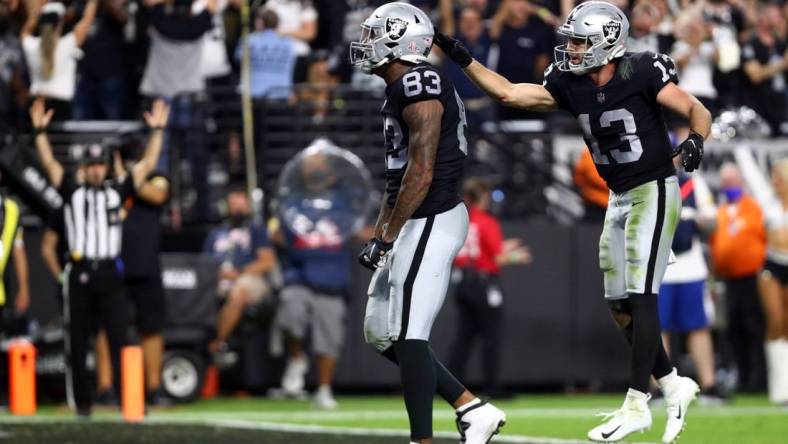 Sep 13, 2021; Paradise, Nevada, USA; Las Vegas Raiders tight end Darren Waller (83) celebrates with wide receiver Hunter Renfrow (13) his touchdown scored against the Baltimore Ravens during the second half at Allegiant Stadium. Mandatory Credit: Mark J. Rebilas-USA TODAY Sports