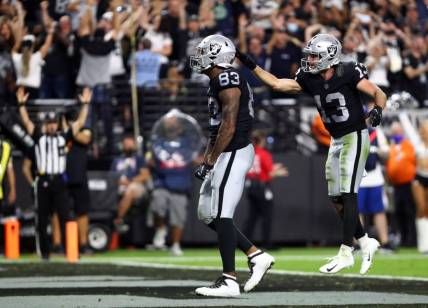 Sep 13, 2021; Paradise, Nevada, USA; Las Vegas Raiders tight end Darren Waller (83) celebrates with wide receiver Hunter Renfrow (13) his touchdown scored against the Baltimore Ravens during the second half at Allegiant Stadium. Mandatory Credit: Mark J. Rebilas-USA TODAY Sports