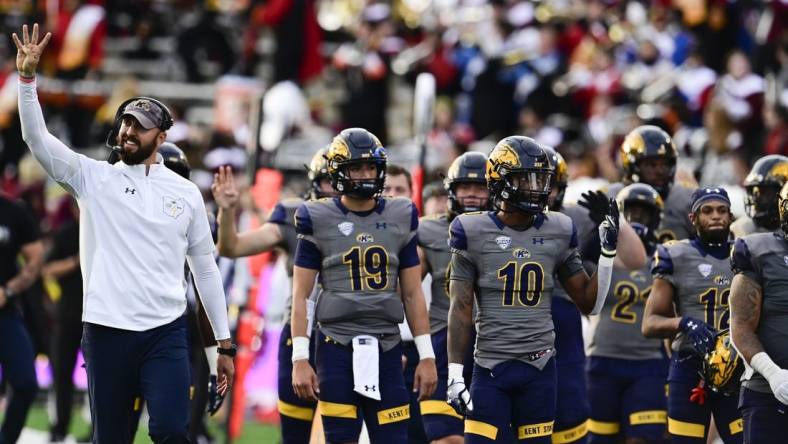 Sep 25, 2021; College Park, Maryland, USA;  Kent State Golden Flashes head coach Sean Lewis walks with players at the beginning of the fourth quarter against the Maryland Terrapins at Capital One Field at Maryland Stadium. Mandatory Credit: Tommy Gilligan-USA TODAY Sports