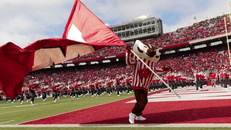 Oct 30, 2021; Madison, Wisconsin, USA;  Wisconsin Badgers mascot Bucky Badger waves the Wisconsin flag prior to the game against the Iowa Hawkeyes at Camp Randall Stadium. Mandatory Credit: Jeff Hanisch-USA TODAY Sports