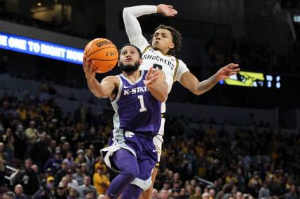 Kansas State's Markquis Nowell drives to the basket during the Wildcats' road game against the Wichita State Shockers Sunday at INTRUST Bank Arena. The Wildcats beat the Shockers 65-59.

B53f4199