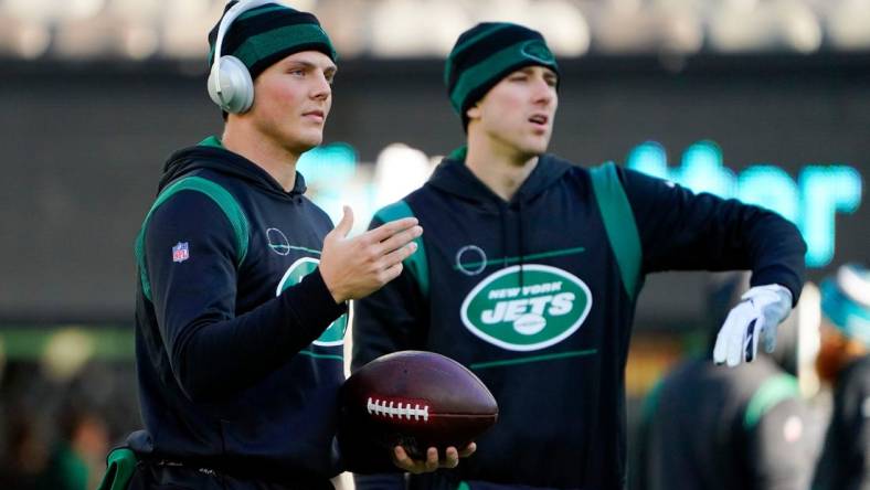 New York Jets quarterbacks Zach Wilson, left, and Mike White signal to receivers during warmups at MetLife Stadium on Sunday, Dec. 26, 2021, in East Rutherford.

Nyj Vs Jax