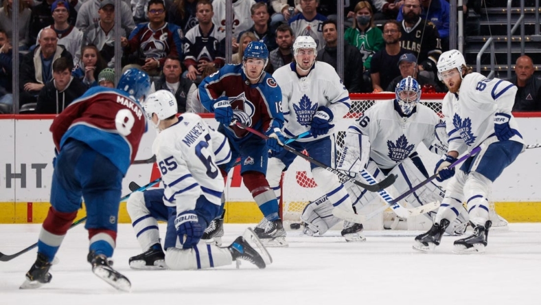 Jan 8, 2022; Denver, Colorado, USA; Toronto Maple Leafs goaltender Jack Campbell (36) and right wing William Nylander (88) and defenseman Justin Holl (3) and Colorado Avalanche center Alex Newhook (18) watch the puck as right wing Ilya Mikheyev (65) turns away from the shot of defenseman Cale Makar (8) in the third period at Ball Arena. Mandatory Credit: Isaiah J. Downing-USA TODAY Sports