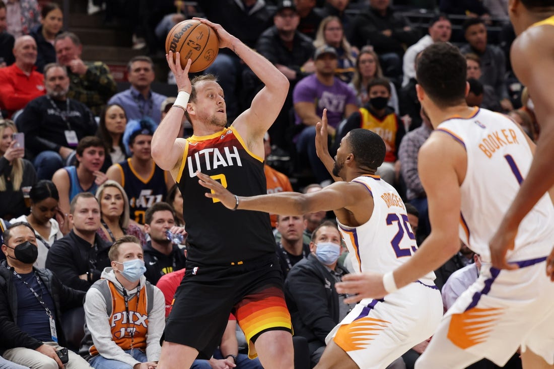 Jan 26, 2022; Salt Lake City, Utah, USA;  Utah's Joe Ingles (2) passes the ball away from Phoenix Suns forward Mikal Bridges (25) during the first quarter at Vivint Arena. Mandatory Credit: Chris Nicoll-USA TODAY Sports