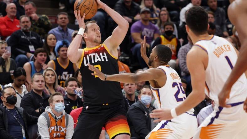 Jan 26, 2022; Salt Lake City, Utah, USA;  Utah's Joe Ingles (2) passes the ball away from Phoenix Suns forward Mikal Bridges (25) during the first quarter at Vivint Arena. Mandatory Credit: Chris Nicoll-USA TODAY Sports