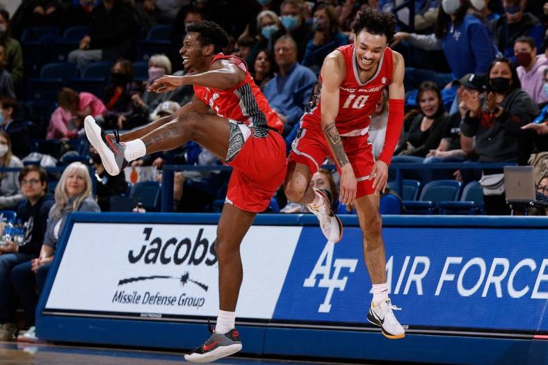Feb 5, 2022; Colorado Springs, Colorado, USA; New Mexico Lobos guard Jaelen House (10) celebrates with guard Jamal Mashburn Jr. (5) after making a half court shot at the buzzer in the first half against the Air Force Falcons at Clune Arena. Mandatory Credit: Isaiah J. Downing-USA TODAY Sports